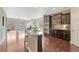 Modern kitchen featuring stainless steel appliances, granite countertops, and dark wood cabinetry at 19382 Dunraven St, Parker, CO 80134