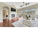 Cozy living room with a fireplace, high ceilings, and sliding glass doors to the backyard at 19382 Dunraven St, Parker, CO 80134