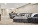 Enjoy ample seating in this expansive living room with a large sectional sofa and neutral tones at 19382 Dunraven St, Parker, CO 80134