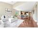 Spacious living room with hardwood floors, vaulted ceilings, open to dining area and kitchen, perfect for entertaining at 19382 Dunraven St, Parker, CO 80134