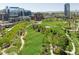Panoramic view showcasing a vibrant cityscape with lush green spaces, walking paths, and nearby buildings at 1440 Little Raven St # 110, Denver, CO 80202