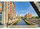 Urban view featuring a bridge, a river and several residential buildings at 1440 Little Raven St # 110, Denver, CO 80202