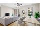 Comfortable living and dining area with a modern sofa, a dining table and a ceiling fan for relaxed and easy living at 1440 Little Raven St # 110, Denver, CO 80202