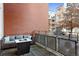 Cozy patio space perfect for relaxing with an outdoor sofa and a modern fire pit for gathering during cool evenings at 1440 Little Raven St # 110, Denver, CO 80202