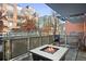 Outdoor patio with a fire pit and seating, perfect for relaxing outdoors at 1440 Little Raven St # 110, Denver, CO 80202