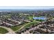 Aerial view displays homes, a lake, green spaces and walking paths within the neighborhood at 11191 W Crestline Dr, Littleton, CO 80127