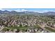 A stunning aerial view shows the neighborhood surrounded by mountains and mature trees at 11191 W Crestline Dr, Littleton, CO 80127