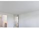 A room with white walls, white carpet, and multiple doors throughout at 11191 W Crestline Dr, Littleton, CO 80127