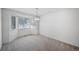 Bright dining room with large windows and neutral carpet at 11191 W Crestline Dr, Littleton, CO 80127