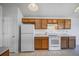 Functional kitchen featuring wooden cabinets and appliances at 11191 W Crestline Dr, Littleton, CO 80127