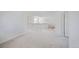 A spacious loft with neutral carpet and white railings provides an open view to the lower level at 11191 W Crestline Dr, Littleton, CO 80127