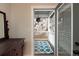 Cozy balcony with wood railings, a patterned rug and a star pendant light fixture at 569 S Race St, Denver, CO 80209