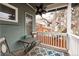 Enclosed balcony seating area with wrought iron furniture at 569 S Race St, Denver, CO 80209