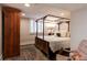 Bedroom featuring a four-poster bed, an area rug, and a wardrobe at 569 S Race St, Denver, CO 80209