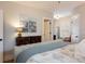 Bedroom with hardwood floors, neutral wall colors and modern decor elements, creating a calm ambiance at 569 S Race St, Denver, CO 80209