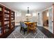 Open dining room with natural light, cozy bench, and built-in bookcase at 569 S Race St, Denver, CO 80209