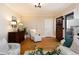 Cozy entryway with wooden floors, vintage cabinet, and charming accents leading to the front door at 569 S Race St, Denver, CO 80209