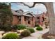 Charming brick home with manicured front yard and inviting covered porch in a desirable neighborhood at 569 S Race St, Denver, CO 80209