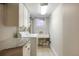 Clean and well-lit laundry room features modern appliances and storage at 569 S Race St, Denver, CO 80209