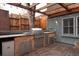 Backyard outdoor kitchen features a built-in gas grill and stone counter at 569 S Race St, Denver, CO 80209