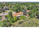 Aerial view of the home showcasing the backyard, patio, shed, and mature trees on a sunny day at 11310 W 46Th Ave, Wheat Ridge, CO 80033