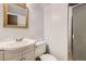 Bathroom featuring a vintage mirror, vanity, toilet and shower at 11310 W 46Th Ave, Wheat Ridge, CO 80033
