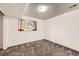Bedroom with a window and plush carpeting at 11310 W 46Th Ave, Wheat Ridge, CO 80033