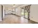 Bright kitchen featuring white appliances, countertops and cabinets, with access to the backyard through sliding glass doors at 11310 W 46Th Ave, Wheat Ridge, CO 80033