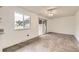 Bright kitchen featuring white countertops and cabinets, with a large window and sliding glass door at 11310 W 46Th Ave, Wheat Ridge, CO 80033