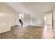 Inviting living area with neutral colors, access to the staircase, and a view of the adjacent space at 11310 W 46Th Ave, Wheat Ridge, CO 80033