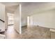 Bright and airy living space featuring neutral walls and modern flooring, seamlessly connected to the staircase and kitchen at 11310 W 46Th Ave, Wheat Ridge, CO 80033