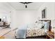 Cozy bedroom with neutral decor, a view into the living area and comfortable furnishings at 1750 Wewatta St # 1230, Denver, CO 80202
