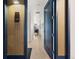 Hallway with wooden floors, modern decor, and bright natural light, showcasing a welcoming entryway at 1750 Wewatta St # 1230, Denver, CO 80202