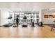 Well-equipped fitness center with treadmills, elliptical machines, and hardwood floors at 1750 Wewatta St # 1230, Denver, CO 80202