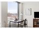 Home office setup by bright window with city view at 1750 Wewatta St # 1230, Denver, CO 80202