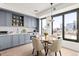 Modern kitchen with sleek gray cabinets, stainless steel appliances, tile backsplash, and city views at 1750 Wewatta St # 1230, Denver, CO 80202