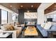 Cozy living room with fireplace, modern furniture, and unique coffee table at 1750 Wewatta St # 1230, Denver, CO 80202