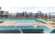 Rooftop pool with lounge chairs overlooking city skyline, providing a luxurious urban retreat at 1750 Wewatta St # 1230, Denver, CO 80202