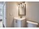 Updated bathroom with modern vanity, stylish mirror, and sleek fixtures at 9605 E Kansas Cir # 53, Denver, CO 80247