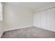 Bedroom featuring neutral gray carpet, white walls and double door closet at 9605 E Kansas Cir # 53, Denver, CO 80247