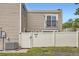 Home exterior featuring fenced yard, balcony, and well-maintained landscaping at 9605 E Kansas Cir # 53, Denver, CO 80247