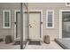 Inviting front entrance features a neutral-toned door, sidelight windows, and decorative hardware at 9605 E Kansas Cir # 53, Denver, CO 80247