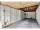 Empty, unfinished garage interior ready to be used for storage or parking at 9605 E Kansas Cir # 53, Denver, CO 80247