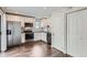 Modern kitchen with stainless steel appliances, white cabinets and subway tile backsplash at 9605 E Kansas Cir # 53, Denver, CO 80247