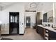 Modern bathroom featuring a sleek black shower, dual vanities, and elegant fixtures at 6502 & 6200 Kiva Ridge Dr, Berthoud, CO 80513