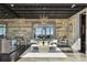 Elegant dining room featuring a modern table, unique lighting, and stylish decor at 6502 & 6200 Kiva Ridge Dr, Berthoud, CO 80513