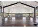 Spacious gym with basketball hoop, high ceilings, and natural light from large windows at 6502 & 6200 Kiva Ridge Dr, Berthoud, CO 80513