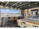 Modern industrial kitchen with a breakfast bar, stainless steel appliances, and mountain views at 6502 & 6200 Kiva Ridge Dr, Berthoud, CO 80513