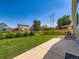 Lush backyard featuring a well-maintained lawn, bushes, and a patio for outdoor enjoyment at 448 Bonanza Dr, Erie, CO 80516