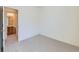 Carpeted bedroom with view of attached bathroom at 448 Bonanza Dr, Erie, CO 80516